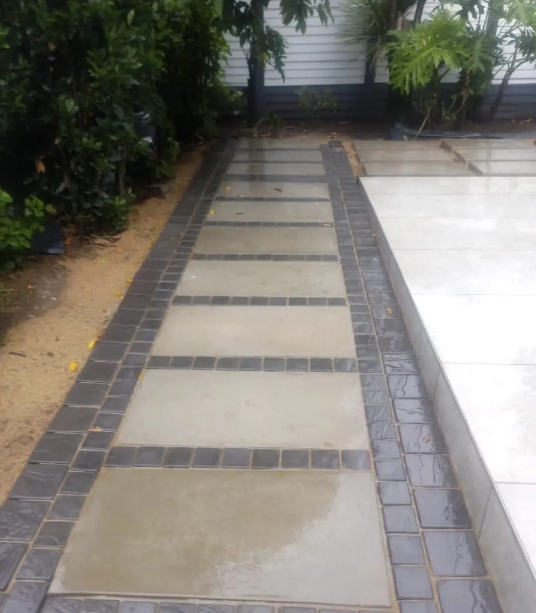 Garden walkway with textured paving slabs